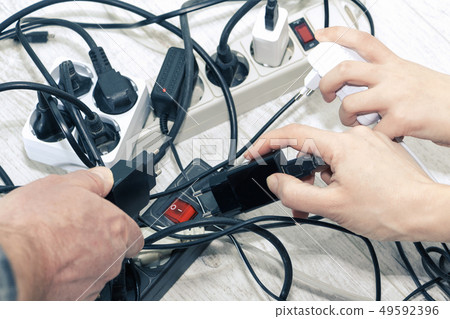 Lots of electrical outlets-enabled devices. Power 49592396
