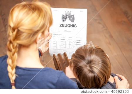 Mother comforting son despite the bad school certificate - Translation: certificate day of birth 49592593
