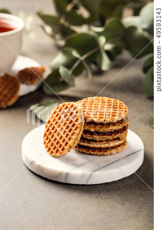Syrupwaffles cookies and cup of tea Syrupwaffles cookies and cup of tea 49593143