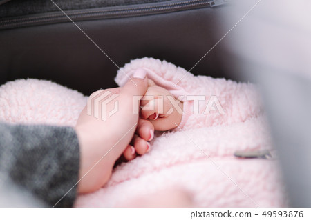 Close up of baby and mom's hands. Little newborn hand Close up of baby and mom's hands. Little newborn hand 49593876