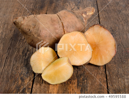 Yacon roots on wooden background Yacon roots on wooden background 49595588