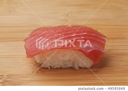 Tuna tuna sushi on a cutting board Tuna tuna sushi on a cutting board 49595849