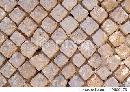 The texture of old squared stones close-up The texture of old squared stones close-up 49600478