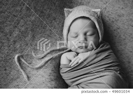 newborn baby in a hat with ears newborn baby in a hat with ears 49601034