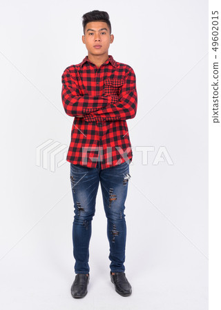 Full body shot of young Asian hipster man against white background 49602015