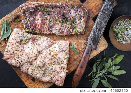 Cured wild pork belly with spices as top view 49602260