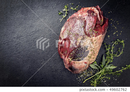 Raw dry aged haunch of venison Raw dry aged haunch of venison 49602762