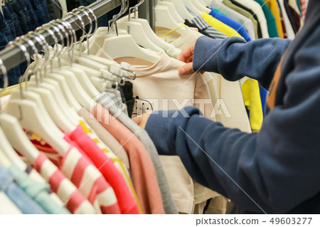 Woman's hand in shopping at a clothing store 49603277