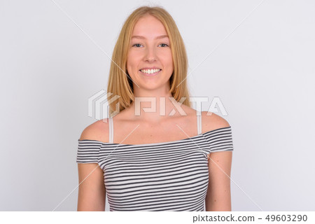 Face of happy young beautiful blonde teenage girl smiling Face of happy young beautiful blonde teenage girl smiling 49603290
