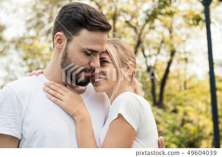 A couple romancing at the park 49604039