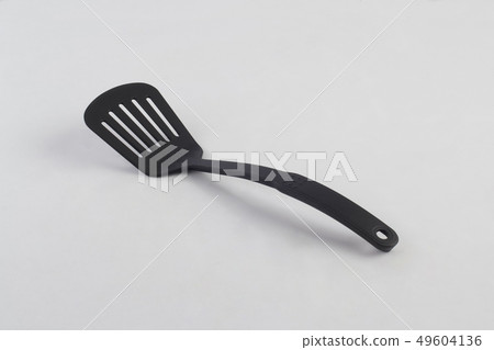 A turner, tool for cooking isolated on white 49604136