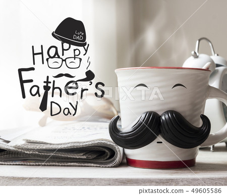 Cup with mustache on wooden table for fathers day 49605586