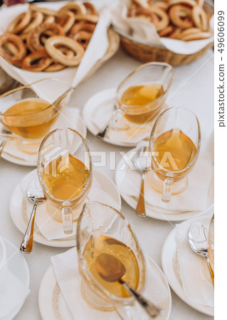 food table bagels honey bowl  tea 49606099