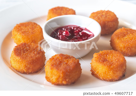 Camembert nuggets with cranberry sauce 49607717