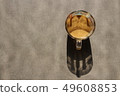 Silhouette from a thicket with coffee on a stone surface 49608853