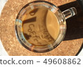 A cup of coffee with milk on a cork base 49608862