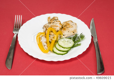 grilled chicken fillet on white plate 49609015