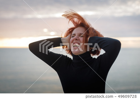Young woman with red hair 49609728