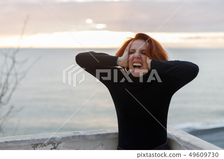Portrait of woman with red hair 49609730