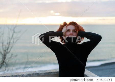 Portrait of woman with red hair 49609731