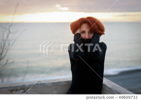 Portrait of a young woman with red hair 49609732