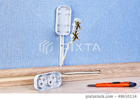 Installing electrican plug socket. Installing electrican plug socket. 49610114