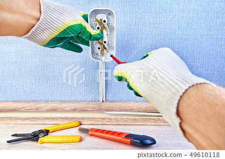 Twisting screw in wall outlet. 49610118