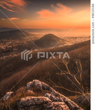 View of a Small City near a River at Sunrise View of a Small City near a River at Sunrise 49610166