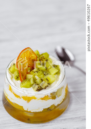 kiwi and peach trifle, appetizing cold dessert kiwi and peach trifle, appetizing cold dessert 49610267