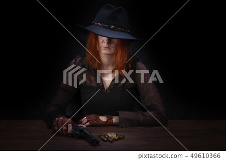 wild west girl with revolver gun  49610366