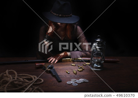 wild west girl with revolver gun  49610370