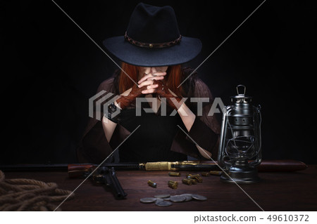 wild west girl with revolver gun  49610372