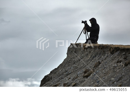 Photographer with tripod Photographer with tripod 49615055