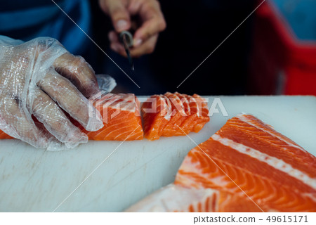 Asian chef slice japanese food sashimi salmon 49615171