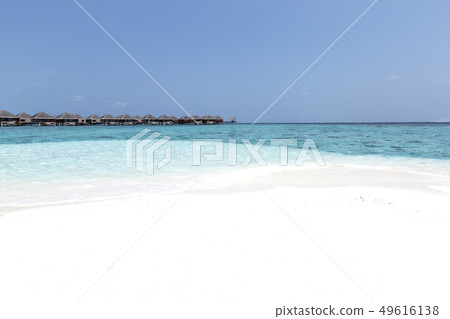 beach with water bungalows at maldivian island beach with water bungalows at maldivian island 49616138