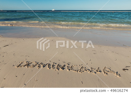 Inscription Dominicana on sandy dominican beach 49616274