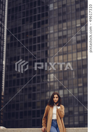 woman walks the streets of Chicago woman walks the streets of Chicago 49617310