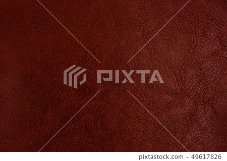 Close-up brown leather texture to background. Close-up brown leather texture to background. 49617826