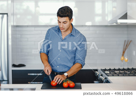 handsome man in a kitchen 49618866