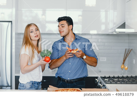 couple at home in a kitchen 49618879