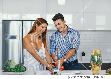 pretty couple in a kitchen pretty couple in a kitchen 49618900