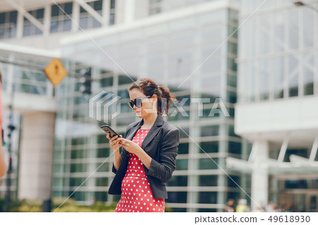 businesswoman in a summer city businesswoman in a summer city 49618930
