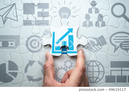 Image of management strategy. Consider business expansion. Complete the jigsaw puzzle. 49619117