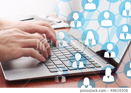 Image of human connections online. Men sending emails with a laptop. 49619308