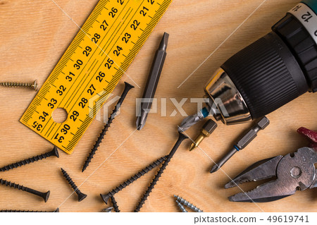 Working Tool on a Wooden Background. construction Working Tool on a Wooden Background. construction 49619741