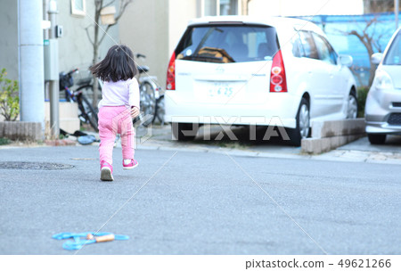 Toddler playing outside 49621266
