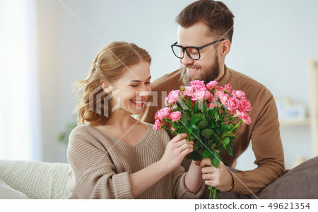 happy loving couple. husband gives his wife happy loving couple. husband gives his wife 49621354