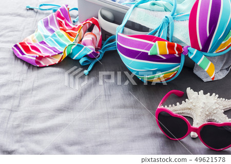 Colorful bikini on the bed 49621578