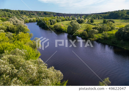 A picturesque nature with a meadow with green tree A picturesque nature with a meadow with green tree 49622047