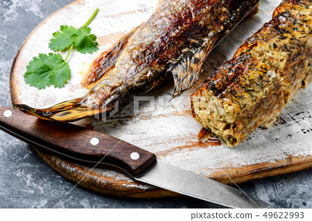 Pike stuffed with vegetables 49622993